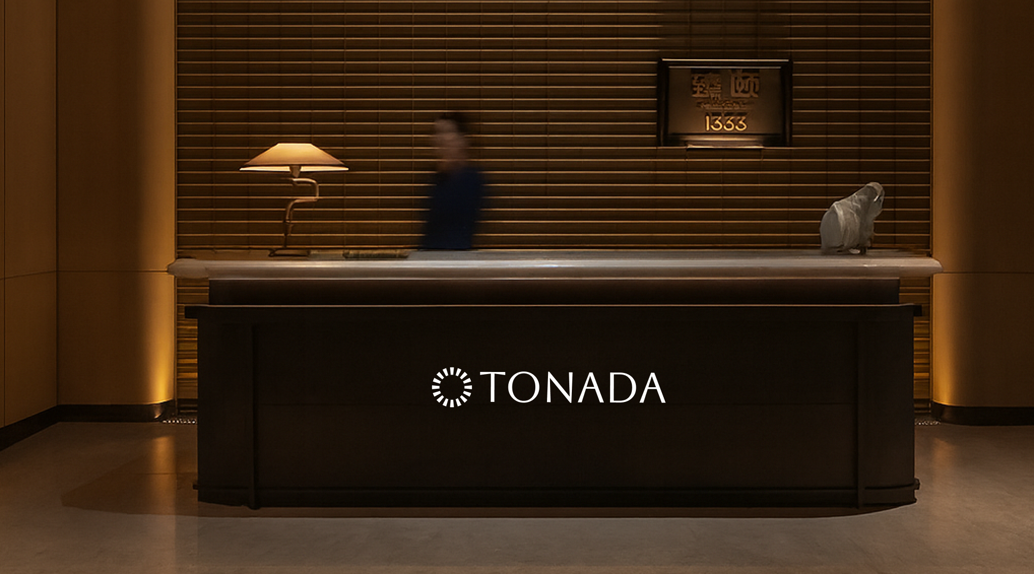 Hotel reception with Tonada branding
